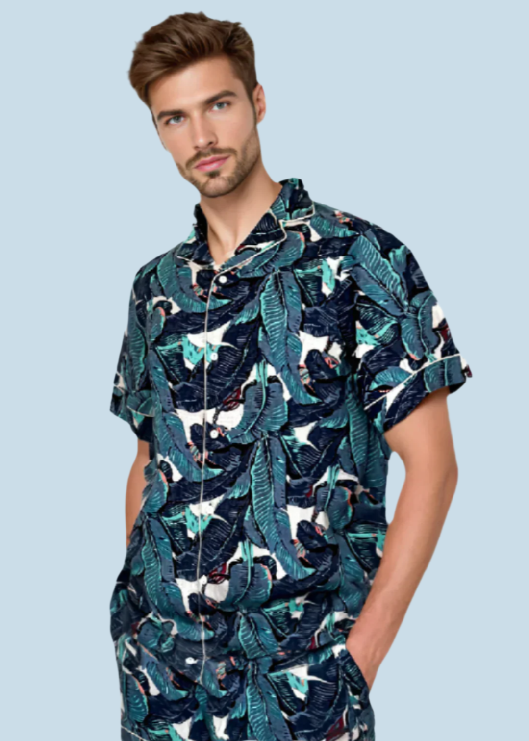 Man posing in N Faria Blue Leaf Luxe PJ Set with hands in pockets.