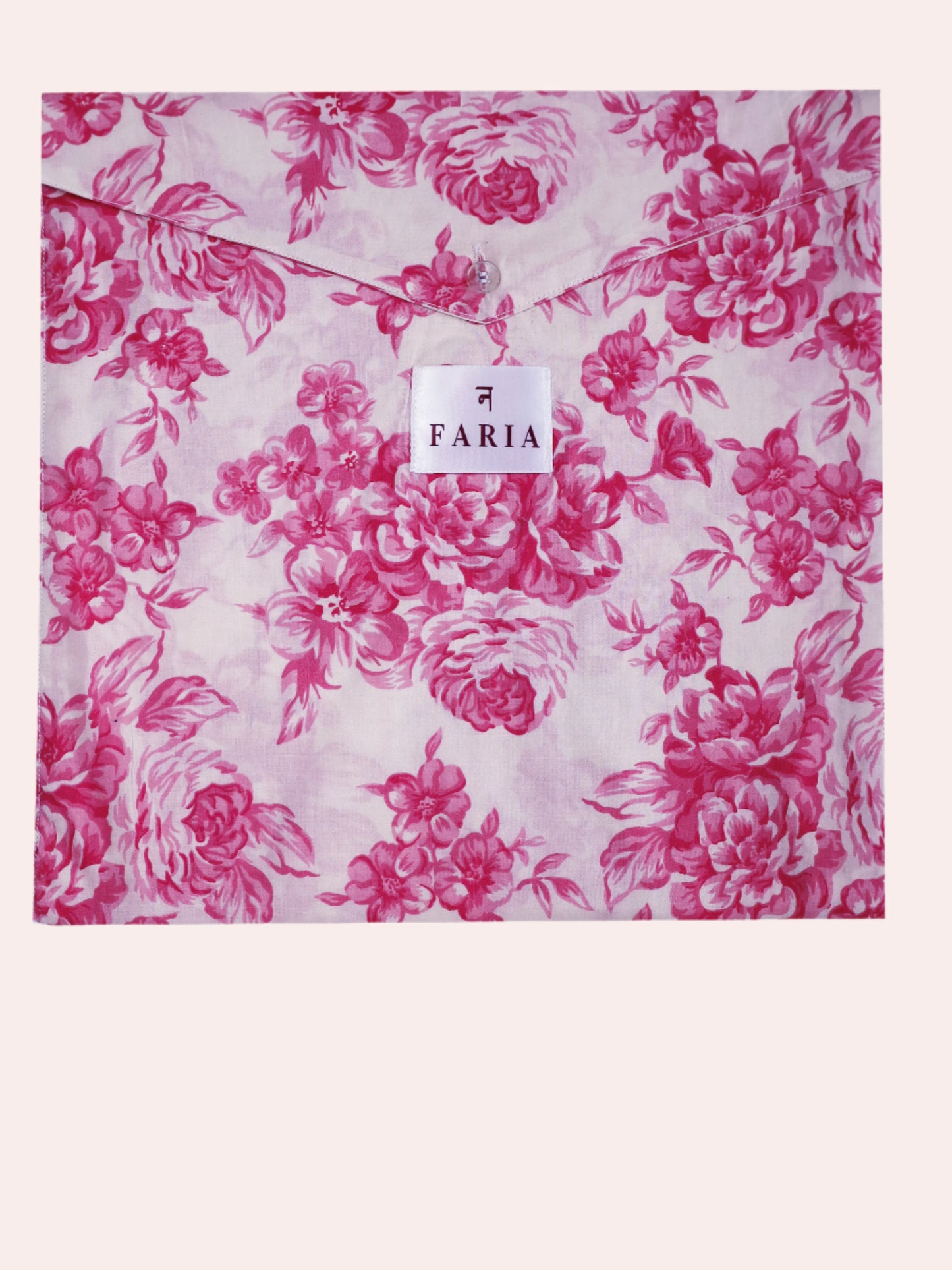 Close-up of N Faria Rosé Luxe matching PJ fabric bag - pink botanical print on soft cotton