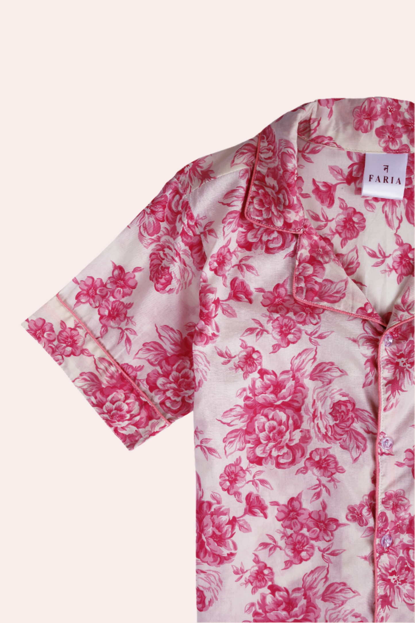 Flat lay of N Faria Rosé Luxe PJ Set – pink short sleeve shirt and shorts