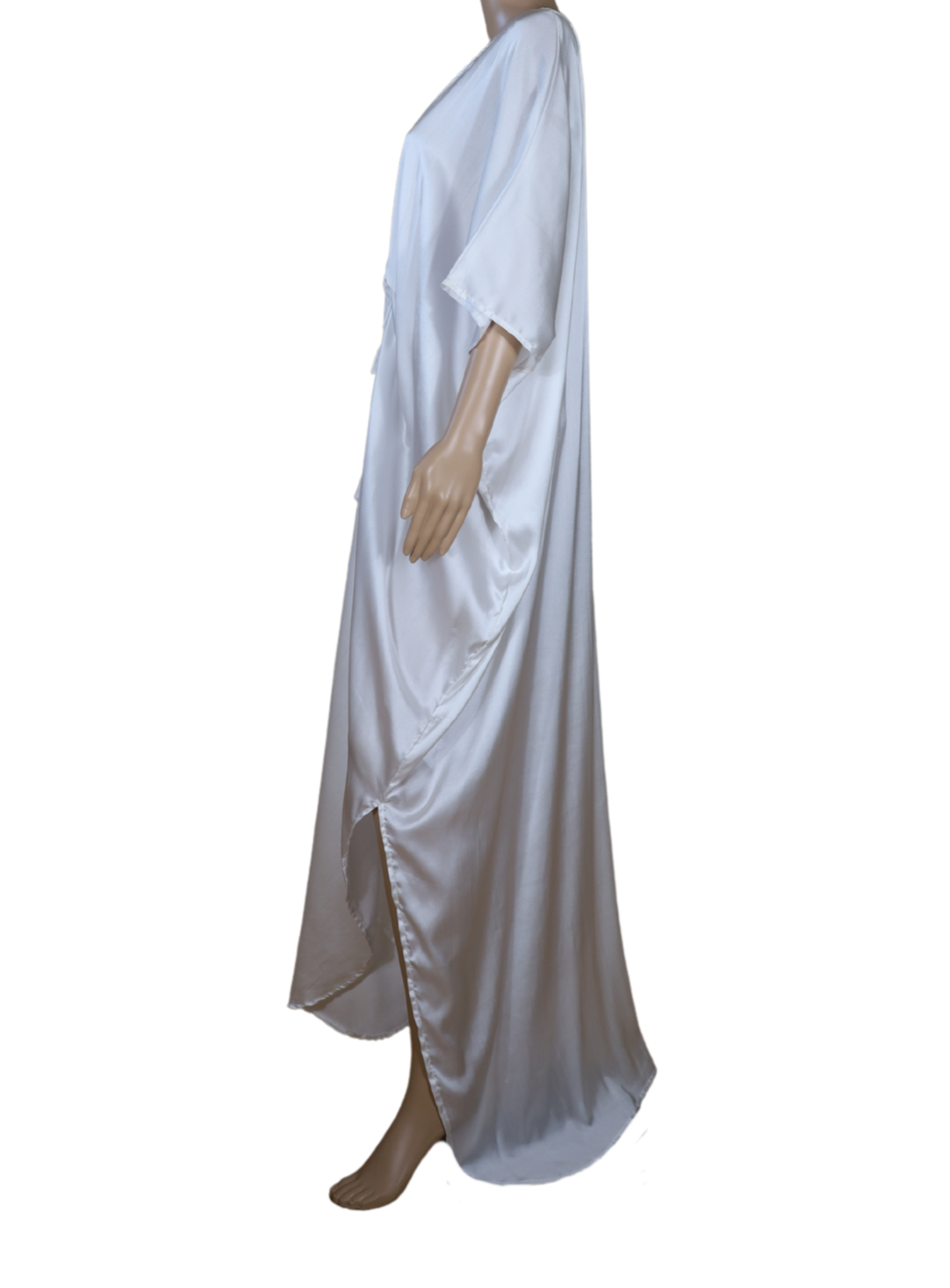 Side profile of N Faria The Ivory Kaftan highlighting relaxed silhouette