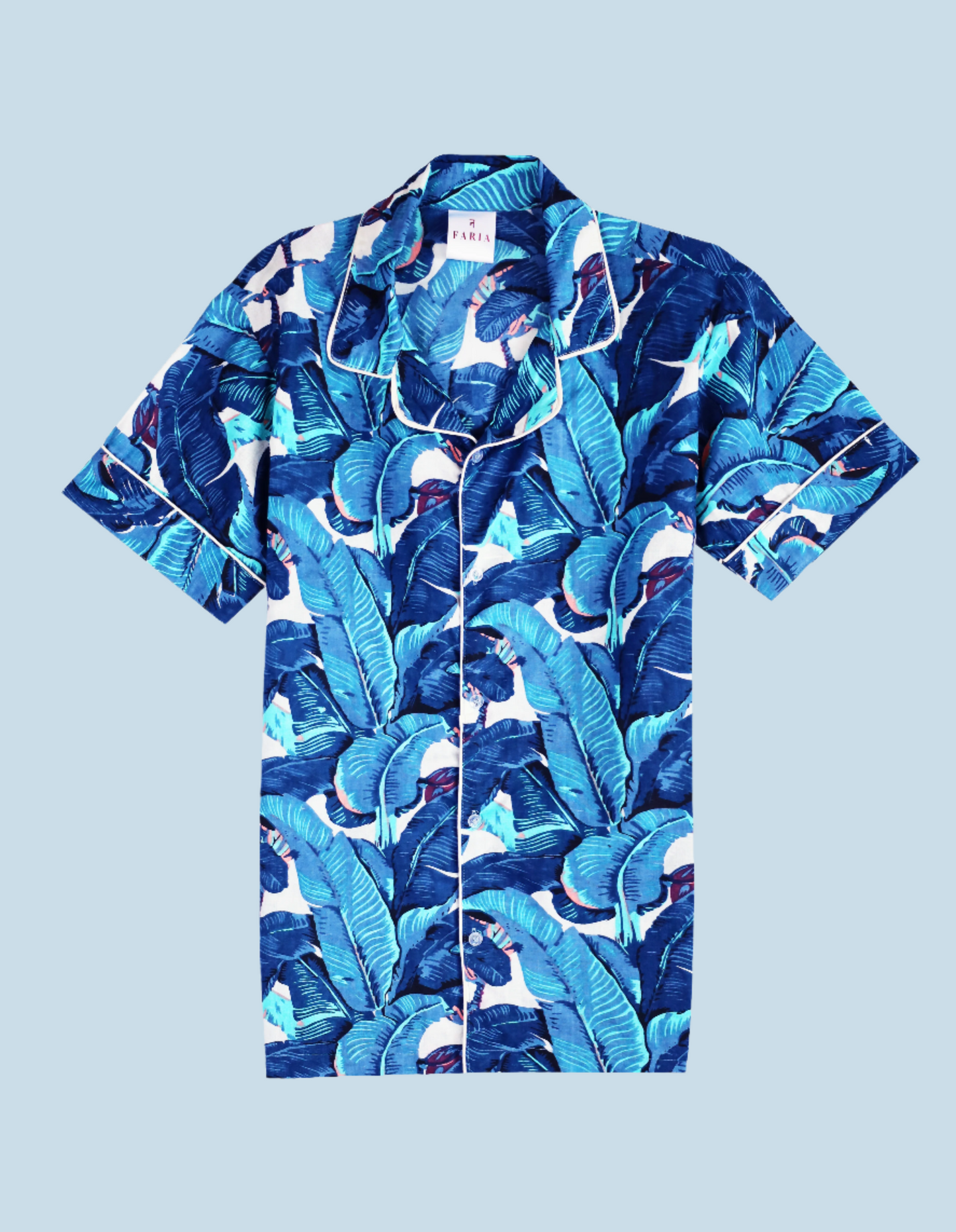Flat lay of N Faria Blue Leaf Luxe PJ shirt with tropical leaf print.