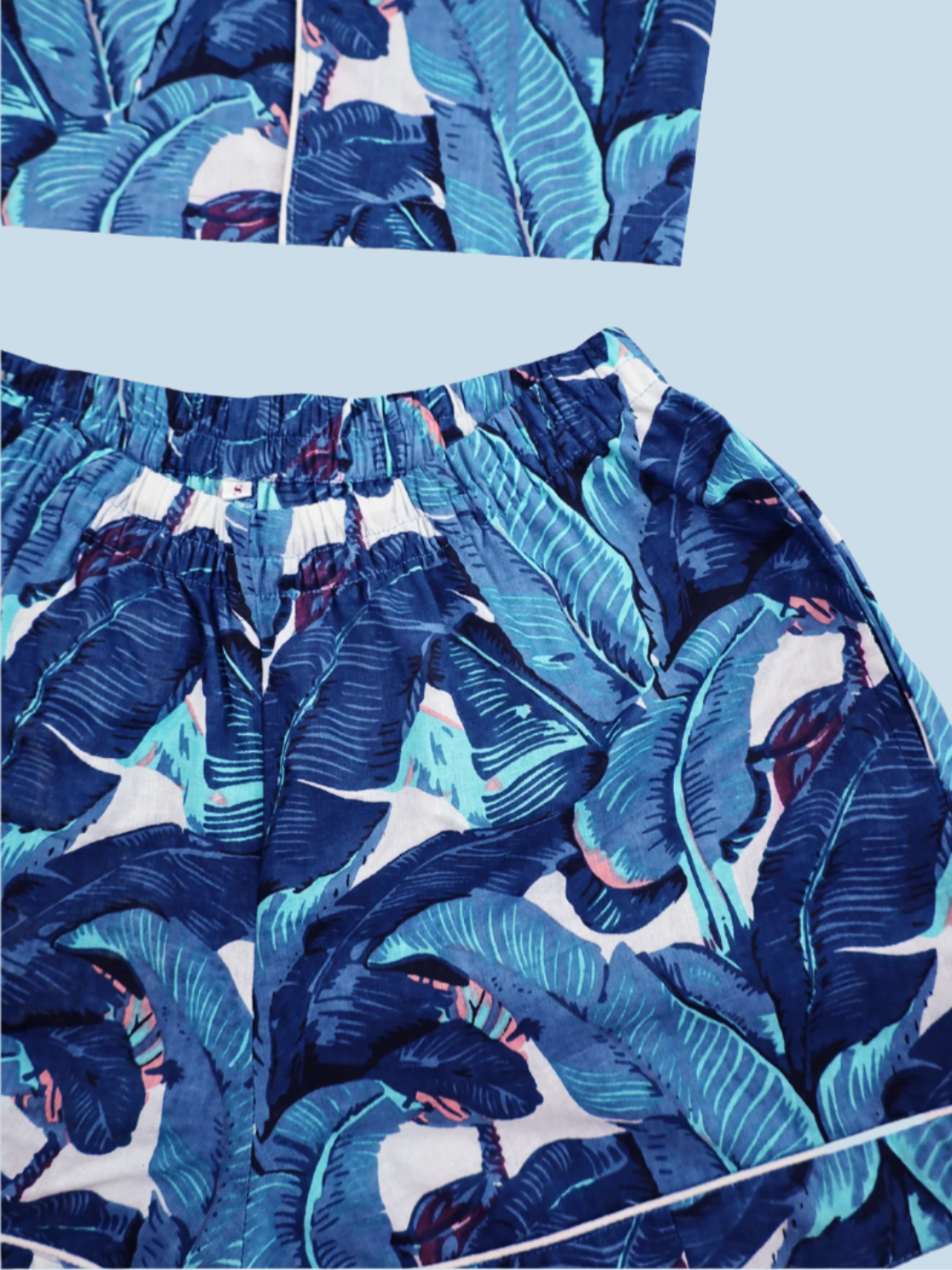 Flat lay of N Faria Blue Leaf Luxe PJ shorts with side pockets.