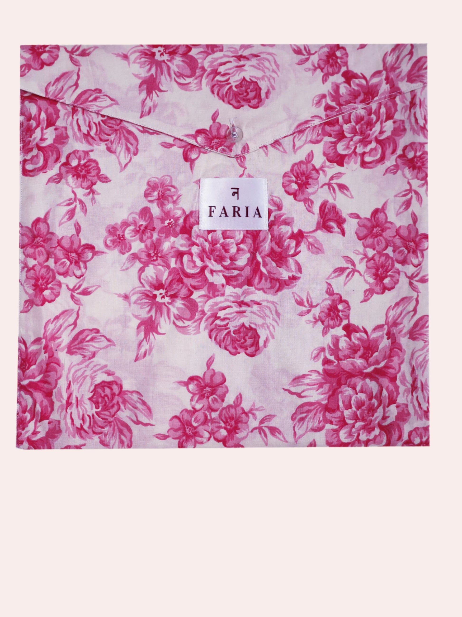 Close-up of N Faria Rosé Luxe matching PJ fabric bag - pink botanical print on soft cotton